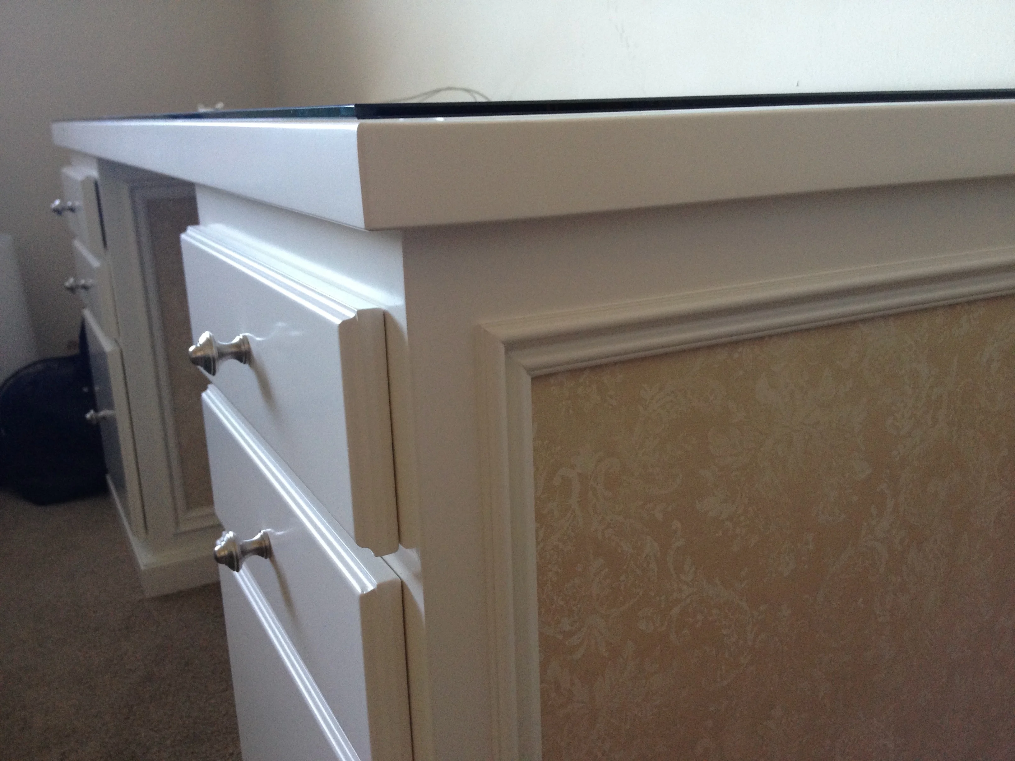 Detailed view of the desk cabinetry and inset side panel