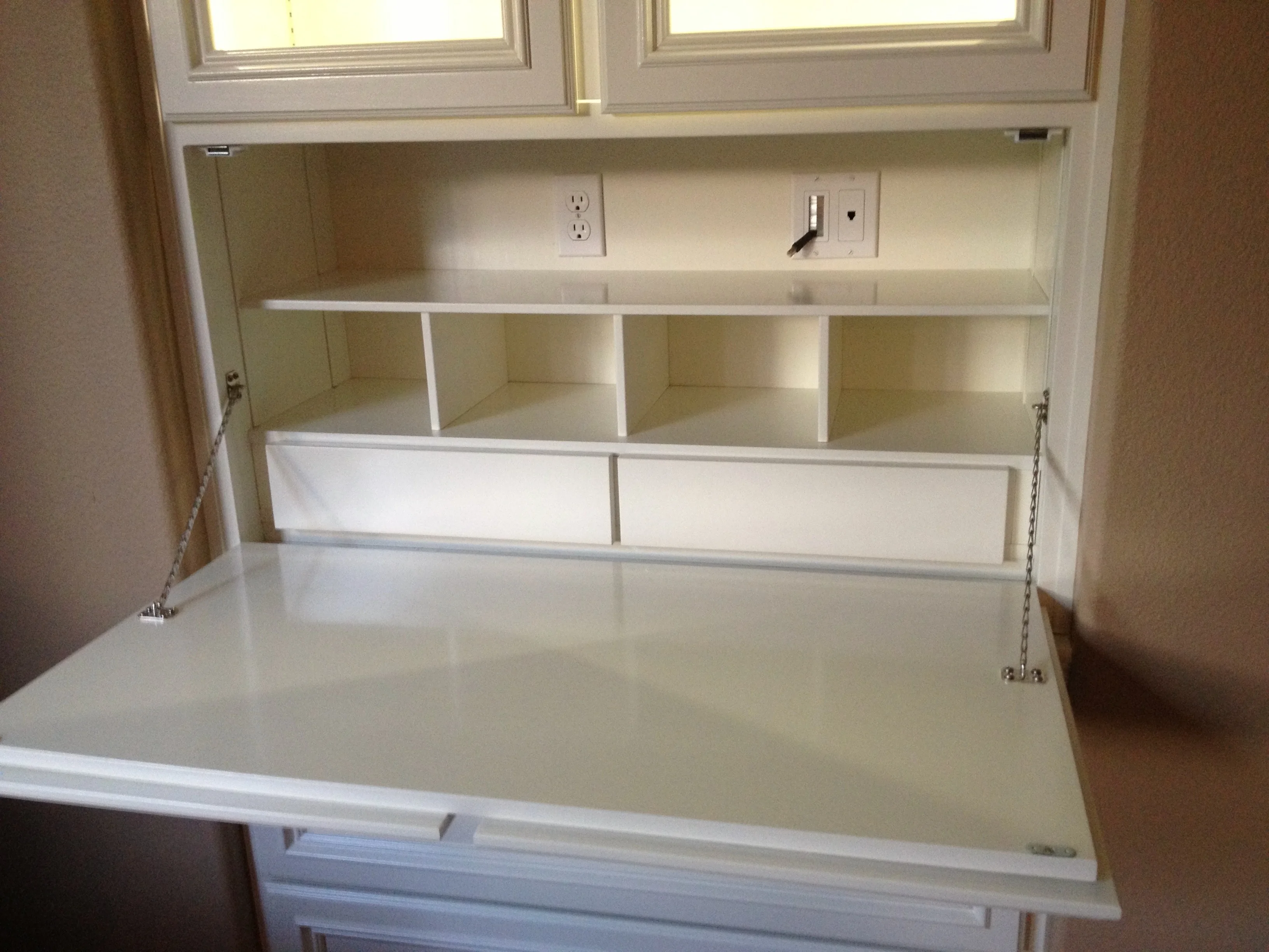 Secretary cabinet with its writing desk folded open