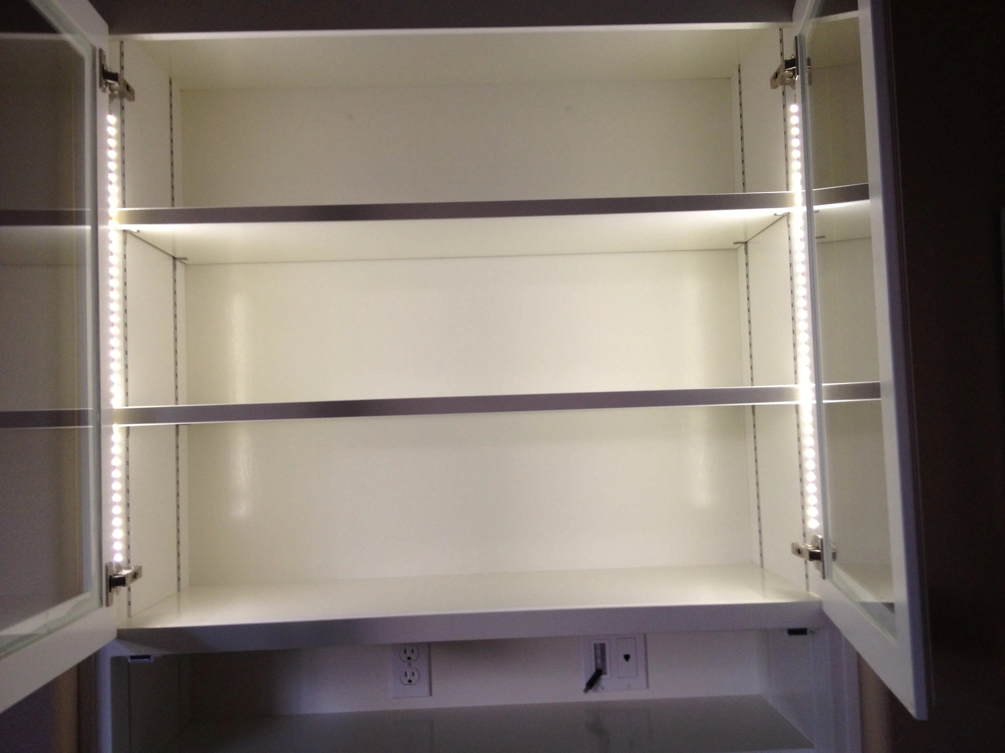 Illuminated adjustable shelves inside the secretary cabinet