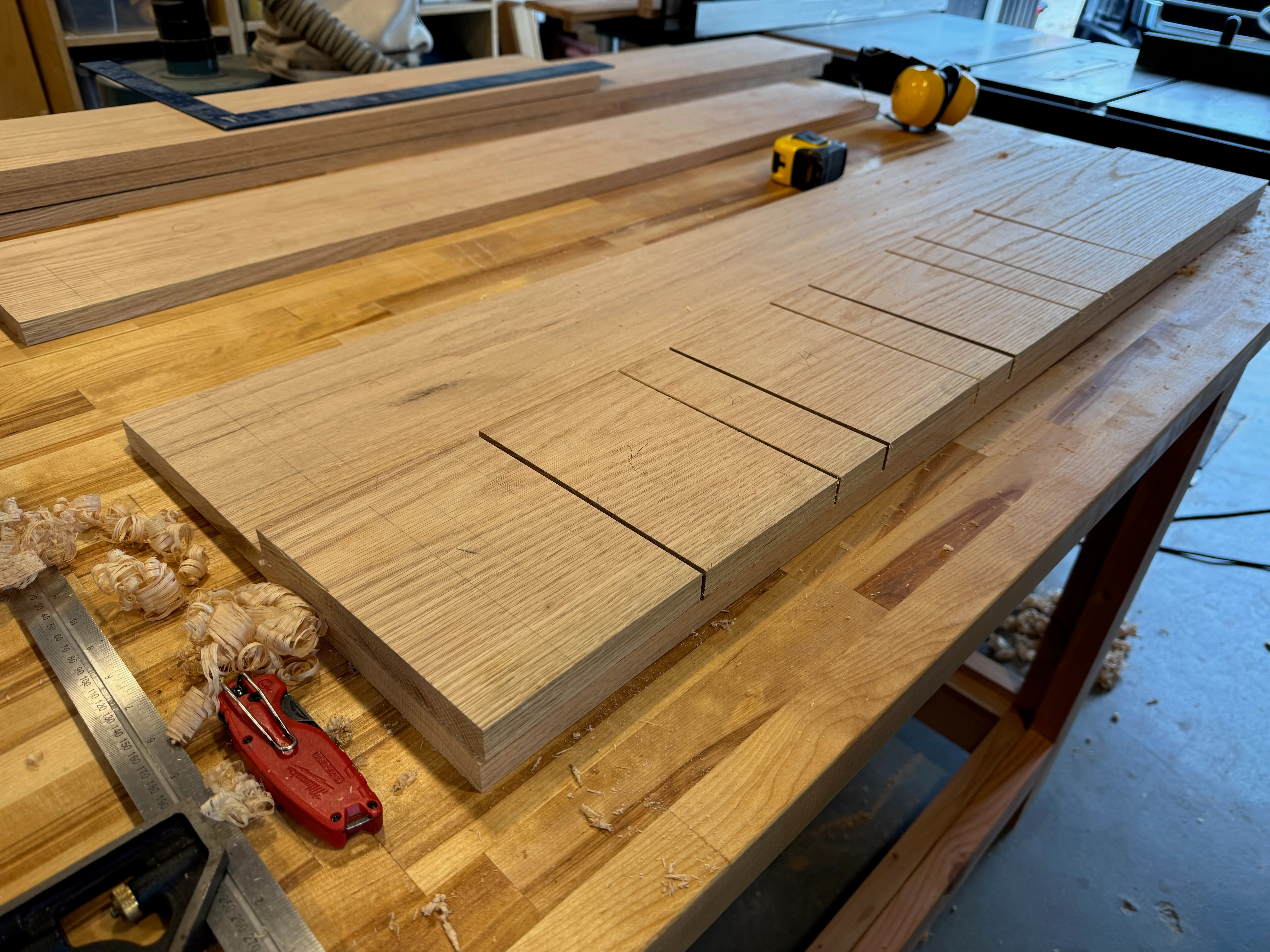 Oak busy board panel being laid out and routed in the workshop